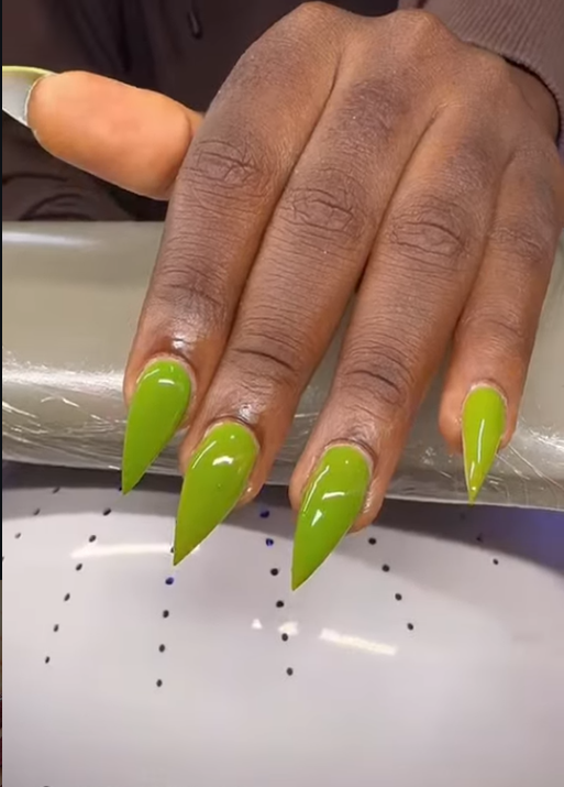 Green pointed nails